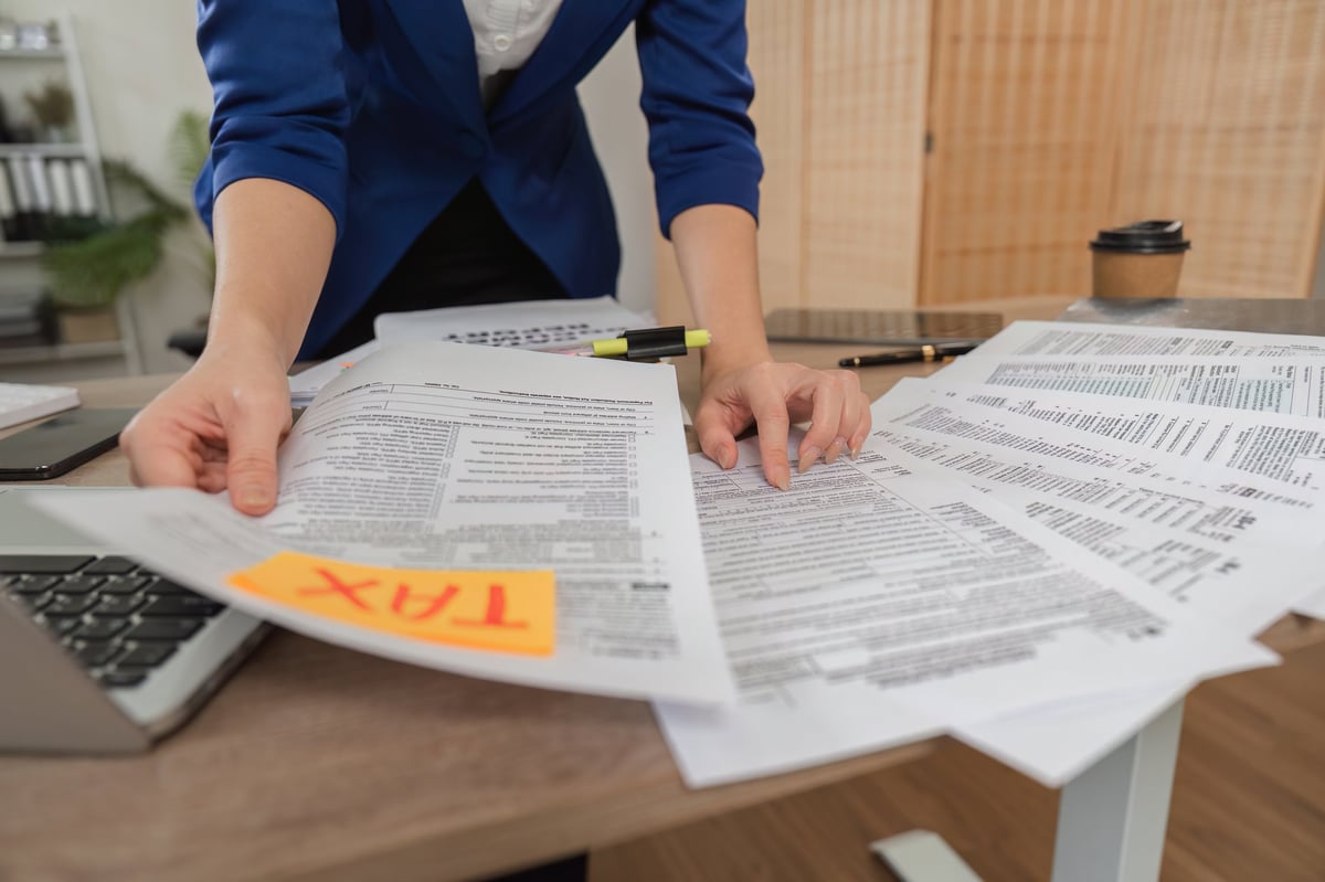 Tax legal recovery review - professional analyzing tax documents and recovery opportunities