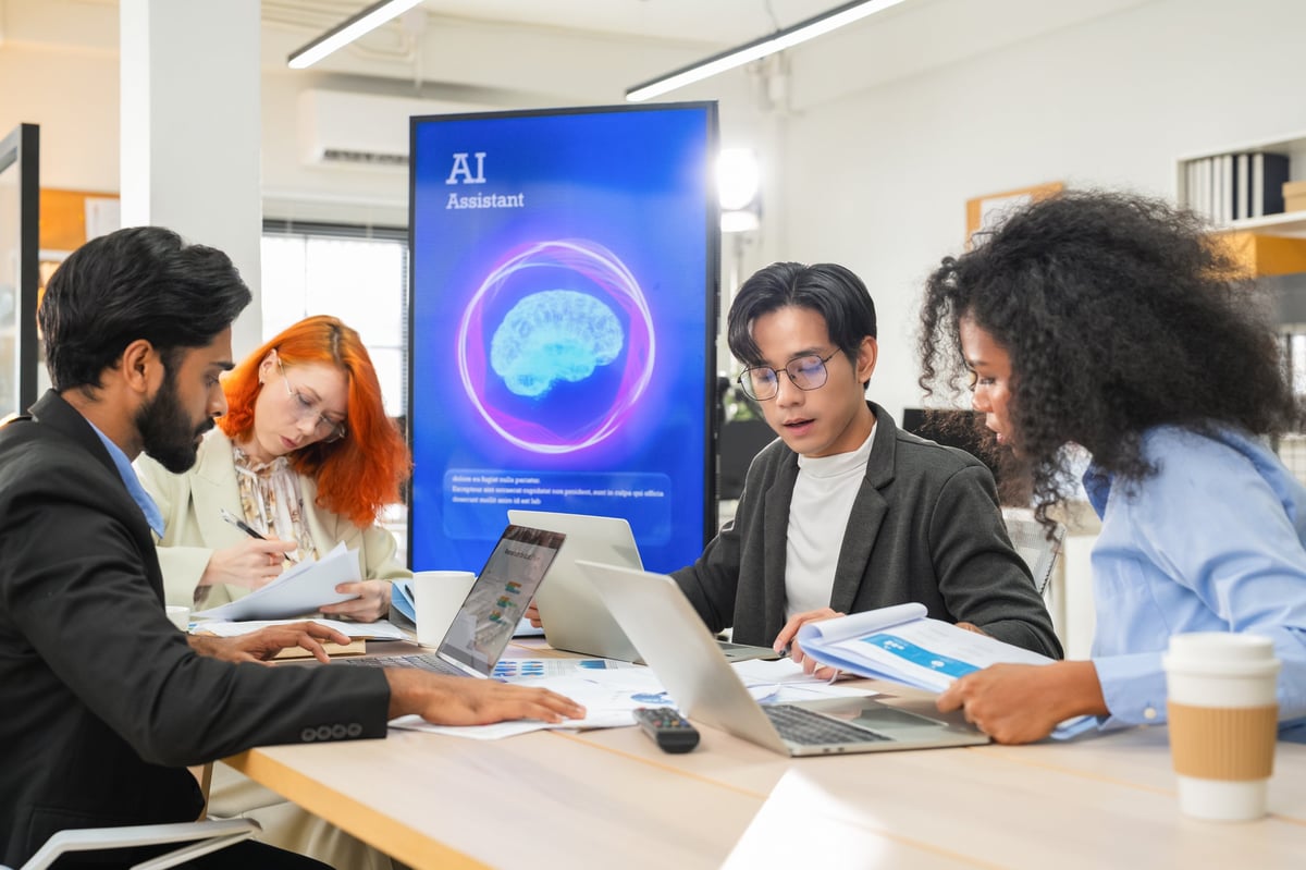 Business professional concentrates in coworking space leveraging AI powered virtual assistant and realtime big data analytics on laptop display for hyper automated workflow intelligence optimization
