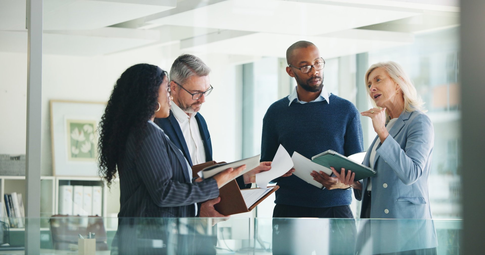 Business professionals reviewing payment operations and finance strategy in modern office